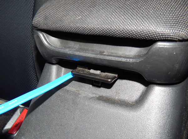 center console in car with USB cable